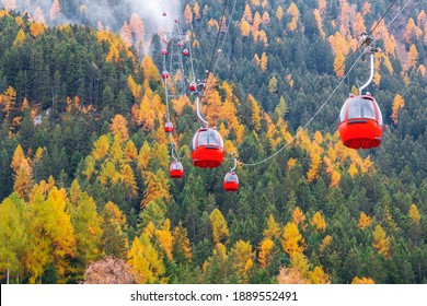 Red ski lift to the Alpe di siusi ski slope from Ortisei ski center in Dolomites in  Italy
