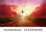 Red  sky at sunset. Beautiful landscape with road   leads up to cross. Religion concept.Christianity background