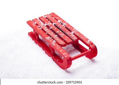 Red Sled With Snow Isolated On White Background