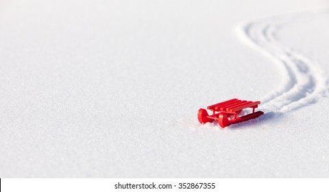 Red Sled With Track On Snow