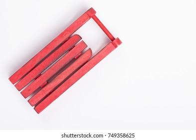 Red Sleigh On A White Background