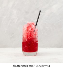 Red Slushie - Drink With Cherry Juice. Refreshing Summer Drink. Sweet Shaved Ice Or Spanish Granizado In Clear Glass With Drinking Straw.