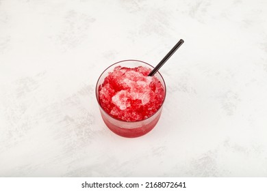 Red Slushie. Sweet Shaved Ice. Spanish Fruit Granizado In Glass With Drinking Straw. Refreshing Summer Drink, Top View.