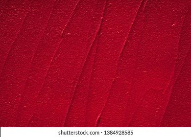Red smear of matte lip gloss isolated on white background.