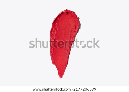 Red smear swipe on white background texture close up macro shot horizontal and vertical beauty lipstick swatch