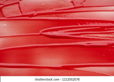 Red Smear And Texture Of Lip Gloss Or Acrylic Paint Isolated On White Background