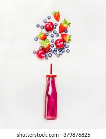 Red Smoothie Drink In Bottle With Straw  And Fruits  Berries Ingredients On White Wooden Background, Top View