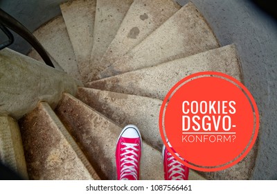 Red sneakers with inscription in german Cookies DSGVO-konform in english Cookies GDPR compliant to symbolize the General Data Protection Regulation in german Datenschutzgrundverordnung