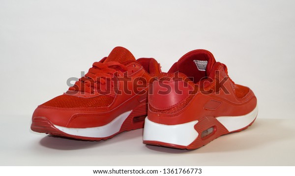 red sneakers with white sole