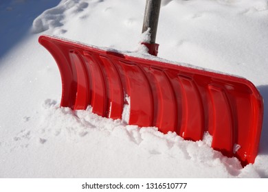 Red Snow Shovel In Heavy Snow               