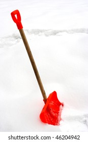 Red Snow Shovel Stick In Snow-drift