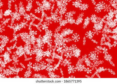 Red snowflake pattern with falling snowflakes