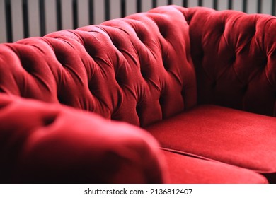 Red Sofa Against The Dark Wall 