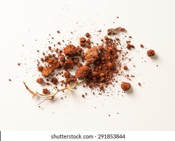 Red Soil Isolated On White Background. Pile Of Dirt And Stones. Top View Of A Heap Of Ground. Close Up Macro View 