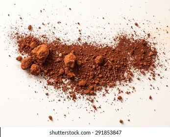 Red Soil Isolated On White Background. Pile Of Dirt And Stones. Top View Of A Heap Of Ground. Close Up Macro View 