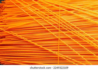 red spaghetti carrot juice dye raw pasta fresh healthy meal food snack on the table copy space food background rustic top view - Shutterstock ID 2249322109