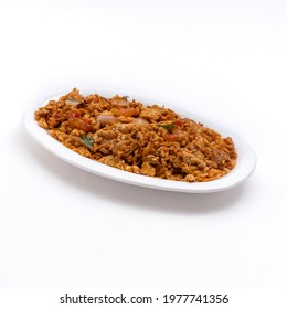 Red Spciy Egg Or Eggs Or Anda Bhurji Or Burji In A White Bowl On White Background 