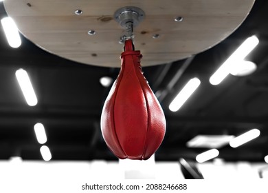 Red Speed Punching Bag In Boxing Gym.