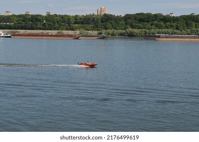 Red Speedboat Racing Over Danube