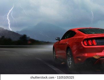 Red Sport Car Drive On Mountain Highway In Storm Night