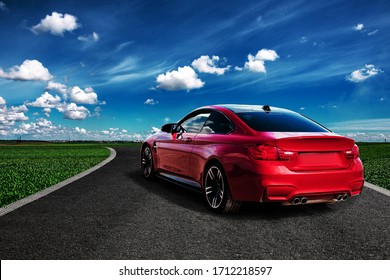 Red sport car on the asphalt road - Shutterstock ID 1712218597