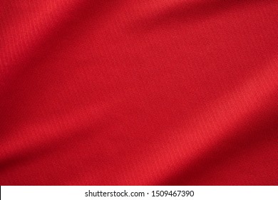 Red sports clothing fabric football jersey texture close up - Powered by Shutterstock