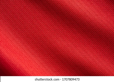 Red sports clothing fabric football jersey texture close up - Powered by Shutterstock