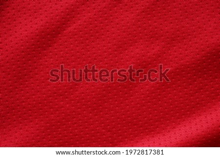 Red sports clothing fabric football shirt jersey texture close up
