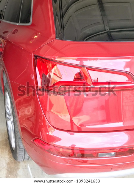 red sports utility\
vehicle reflections