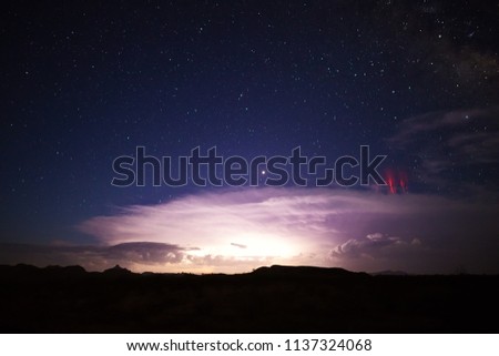 Red sprites (cold plasma lightning) above a powerful thunderstorm.