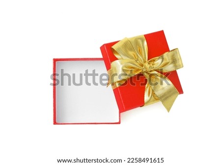 Red square gift box open golden bow ribbon isolated on white background. Top view