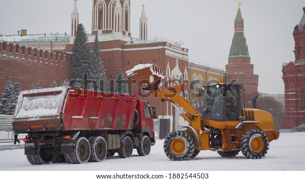 Red Square in Moscow. snow machines eliminates the\
effects of snowfall. transport equipment clears the red square in\
Moscow from snow.