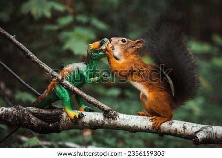 A red squirrel takes food from a toy dinosaur in the forest.