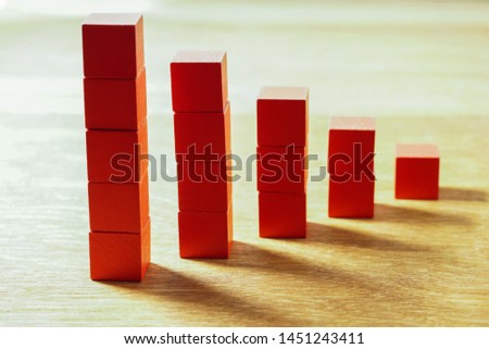 red stack of cube building blocks