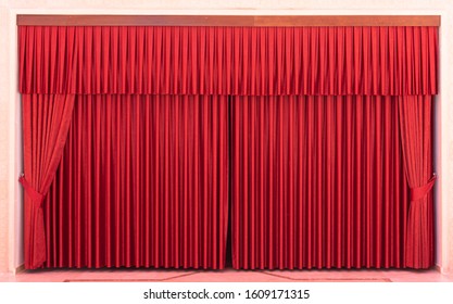 Red Stage Curtains And Empty Seats