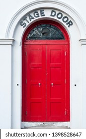 Red Stage Door At The Back Of A Theatre