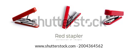 Red stapler isolated on a white background. High quality photo