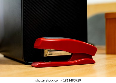 red stapler on the table