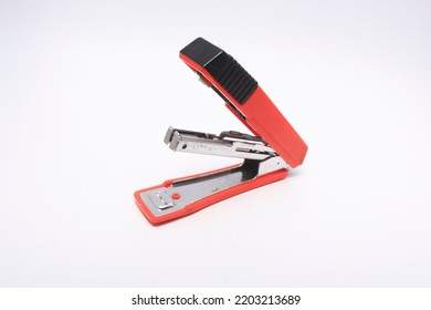 Red Stapler On A White Background