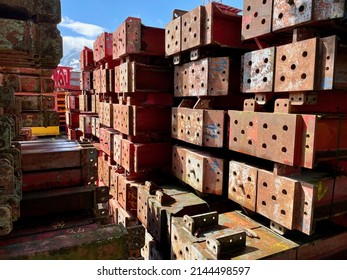 Red Steel Beams In Outdoor Storage. High Quality Photo