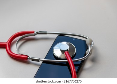 Red Stethoscope On Black Smartphone Represents Health Records And Digital Patient Records With Mobile Devices For Digital Doctors And Digital Diagnostic Treatment With Modern Equipment And Technology