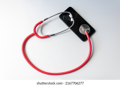 Red Stethoscope On Black Smartphone Represents Health Records And Digital Patient Records With Mobile Devices For Digital Doctors And Digital Diagnostic Treatment With Modern Equipment And Technology