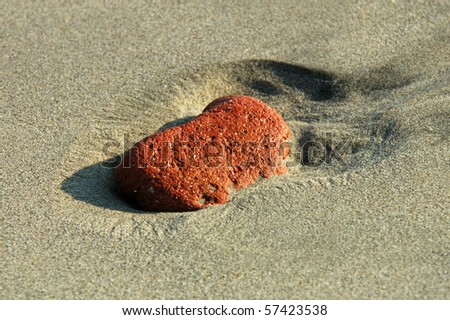 Similar – Beautiful hand holding a stone, on a beach sand background.