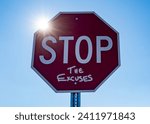 Red stop sign with sunburst reading stop the excuses