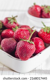 Red Strawberries In A White Square Bowl.