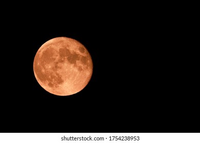 Red Strawberry Moon And Black Sky