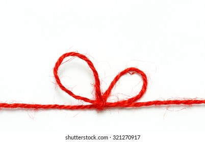 Red String Bow On A White Background.