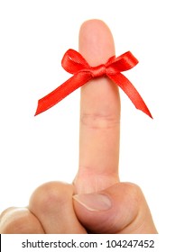 Red String Tied Around Finger As A Reminder, Isolated On White Background.