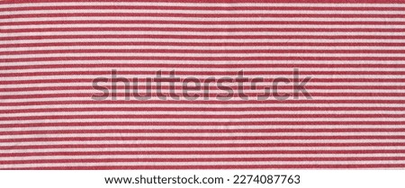 Red striped tablecloth background texture. Fabric wallpaper. Horizontal banner