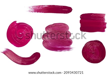 Red stroke brush lipstick or paint on white empty background. Cosmetics or acrylic stains for decoration and design.